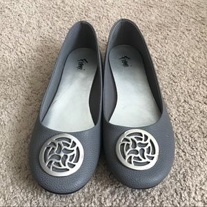 Gray ballerina flats with silver medallion
